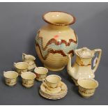 A 1930s five place setting tea service, on a cream ground with hand-painted floral decoration;