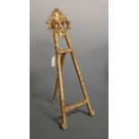 A late 19th century carved pine and gilt painted table top easel, height 52cm