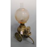 An unusual early 20th century Indian brass oil lamp, having probably associated opalescent glass