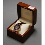 A gents Adee Kaye gilt metal cased wrist watch having a blue enamel dial with bronzed raised Roman