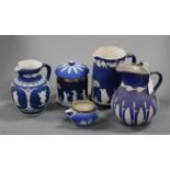 A small collection of Victorian Wedgwood blue jasper wares to include water jugs, storage jar and