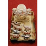 A box of miscellaneous china to include 19th century and later Staffordshire cow creamers, a John