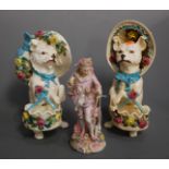 A matched pair of 19th century continental porcelain figures, each in the form of a dog in floral