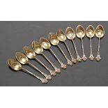 A set of eleven early 20th century American sterling silver coffee spoons, each having shell