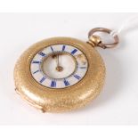 A continental 18ct gold cased half hunter pocket watch, having fine engine turned decoration,