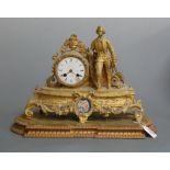 A late 19th century French gilt metal mantel clock having a circular dial with Roman numerals signed