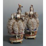 A pair of late 19th century Naples porcelain figures of female dancers, in floral encrusted