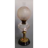 A Victorian oil lamp, having opalescent glass shade above a clear glass font, on brass pedestal