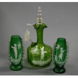 A Victorian green glass water carafe and stopper with Mary Gregory decoration, together with a