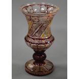 A 19th century Bohemian overlaid pedestal glass vase, the whole being wheel engraved with panels