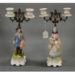 A pair of 19th century continental bisque porcelain figural twin sconce candelabra, height 34cm