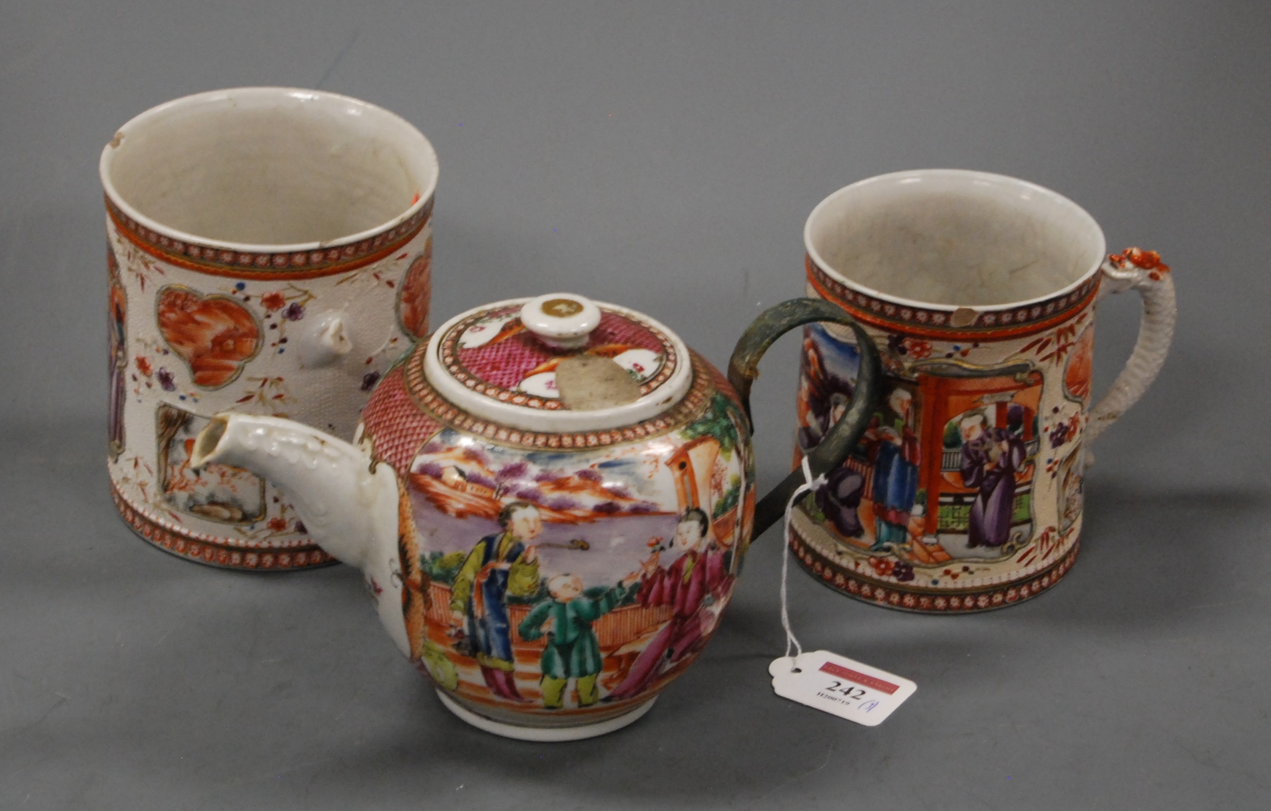 An 18th century Chinese porcelain teapot and cover of bullet shape decorated in the Famille Rose