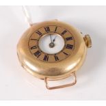 A lady's continental 18ct gold cased half hunter wristwatch, with enamel set monogram to back,