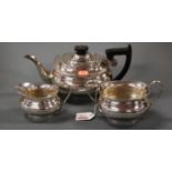 A Regency style silver three piece tea set comprising teapot, twin handled sugar and cream, each