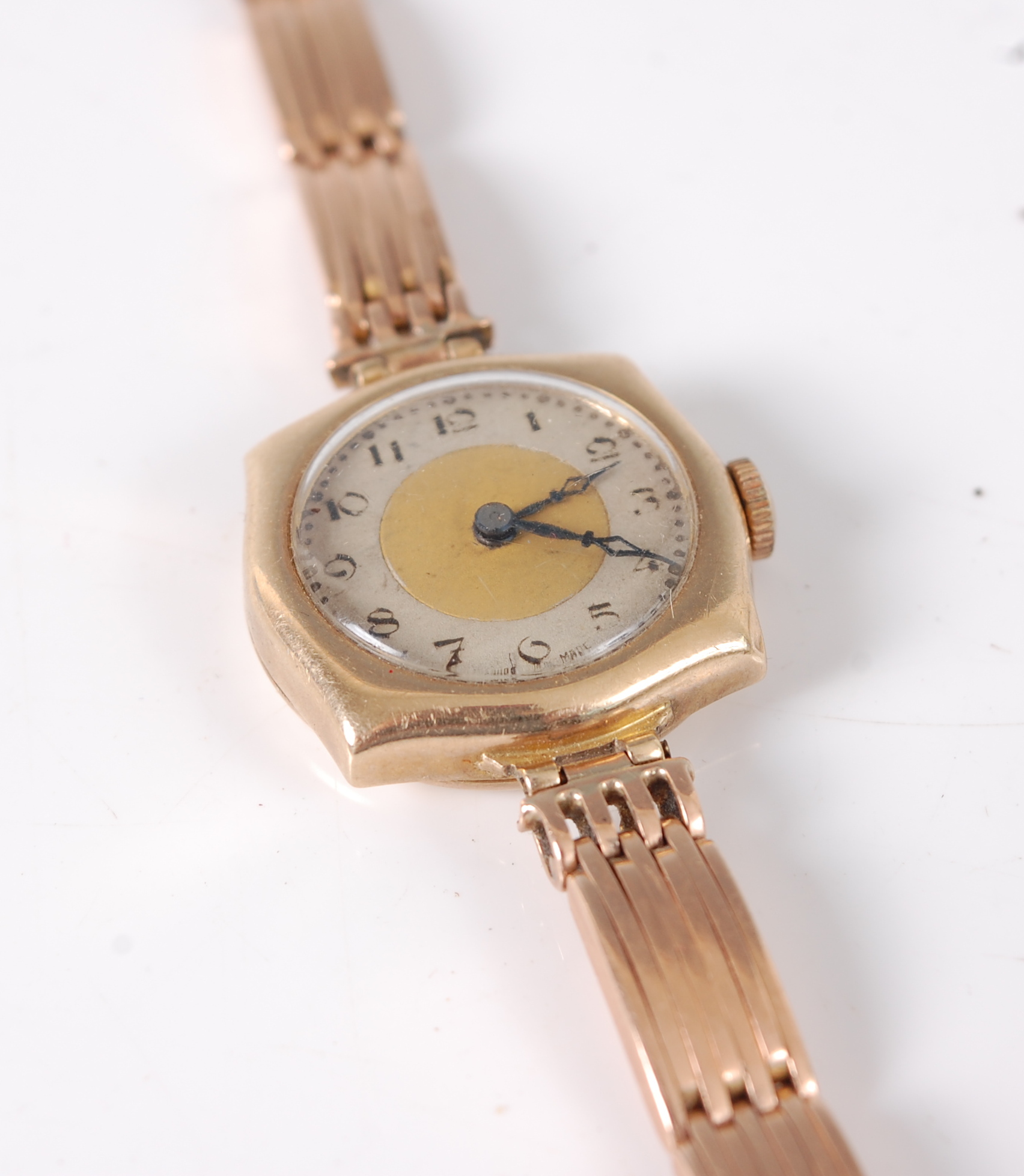 A lady's 9ct gold vintage wristwatch, having mechanical movement, on associated 15ct gold