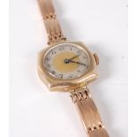 A lady's 9ct gold vintage wristwatch, having mechanical movement, on associated 15ct gold