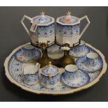 A late Victorian Wedgwood part tea service, with transfer decoration heightened in gilt,