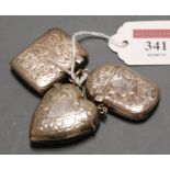 A late Victorian silver vesta, in the shape of a heart, having foliate engraved decoration and