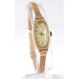 An Art Deco lady's 9ct gold cased tank watch, having mechanical movement, on gold meshlink strap,