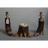 A pair of modern deer's hoof and brass mounted candlesticks, together with a matching bowl, height