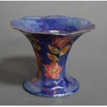 A 1930s Kensington ware lustre vase on a blue ground with floral decoration impressed Gem Made in