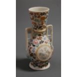 A late 19th century continental vase, having a tapering rim to a bulbous lower body, the central