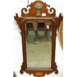 An early 20th century Chippendale style mahogany fret carved bevelled wall mirror, 80 x 42cm