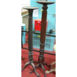 Two similar early 20th century mahogany pedestal plant stands, the largest h.147cm