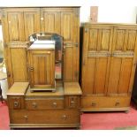 A suite of moulded linenfold oak bedroom furniture, to include; large double door wardrobe, small