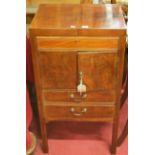 A 19th century mahogany gentleman's washstand, the twin fold-over top having rise-and-fall mirror,