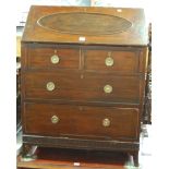 An early 20th century mahogany slopefront writing bureau, having two short over two long drawers,