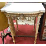 A late 19th century French faded giltwood and gesso white marble topped console table, having a
