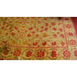 A floral stylised woollen yellow ground rug, 250 x 180cm