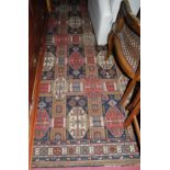 A Persian style woollen rug having all over floral geometric stylised ground, approx 360 x 275cm