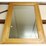 A contemporary blond oak wall mirror, 137 x 91cm