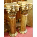 A pair of contemporary stained and carved hardwood composition columns, h.102cm