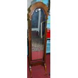 A 1930s walnut cushion topped cheval mirror, w.40.5cm