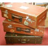 Three various vintage suitcases to include two with luggage labels