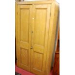 A Victorian stained pine double door pantry cupboard, having fixed interior shelves, w.107cm