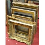 A collection of various mostly giltwood picture frames, 19th century and later, with some ebonised