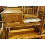 A contemporary oak linenfold panelled telephone seat, with single cupboard door, w.94cm