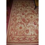 A contemporary Persian style cream ground floral decorated rug, 240 x 162cm
