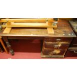 A late 19th century mahogany topped and stained pine large kneehole single pedestal desk, fitted