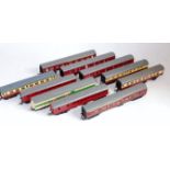 Small tray containing Triang bogie coaches 3x medium length red/cream, 2x carmine suburban, 4x scale