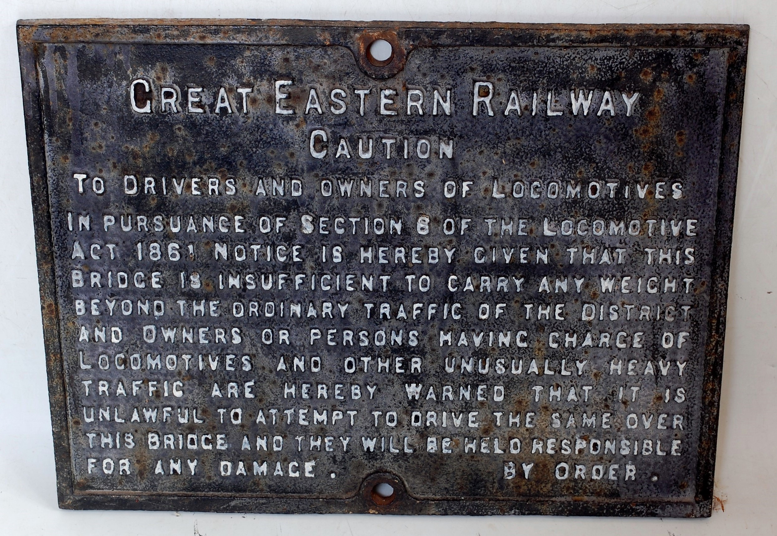 An original cast iron Great Eastern Railways 'Caution' sign to drivers and owners of the locomotive,