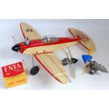 A balsa wood and plastic kit built petrol powered radio controlled aircraft, sold with a quantity of