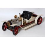 A Mamod SR1A steam roadster comprising of white and red body with base metal detailing, model