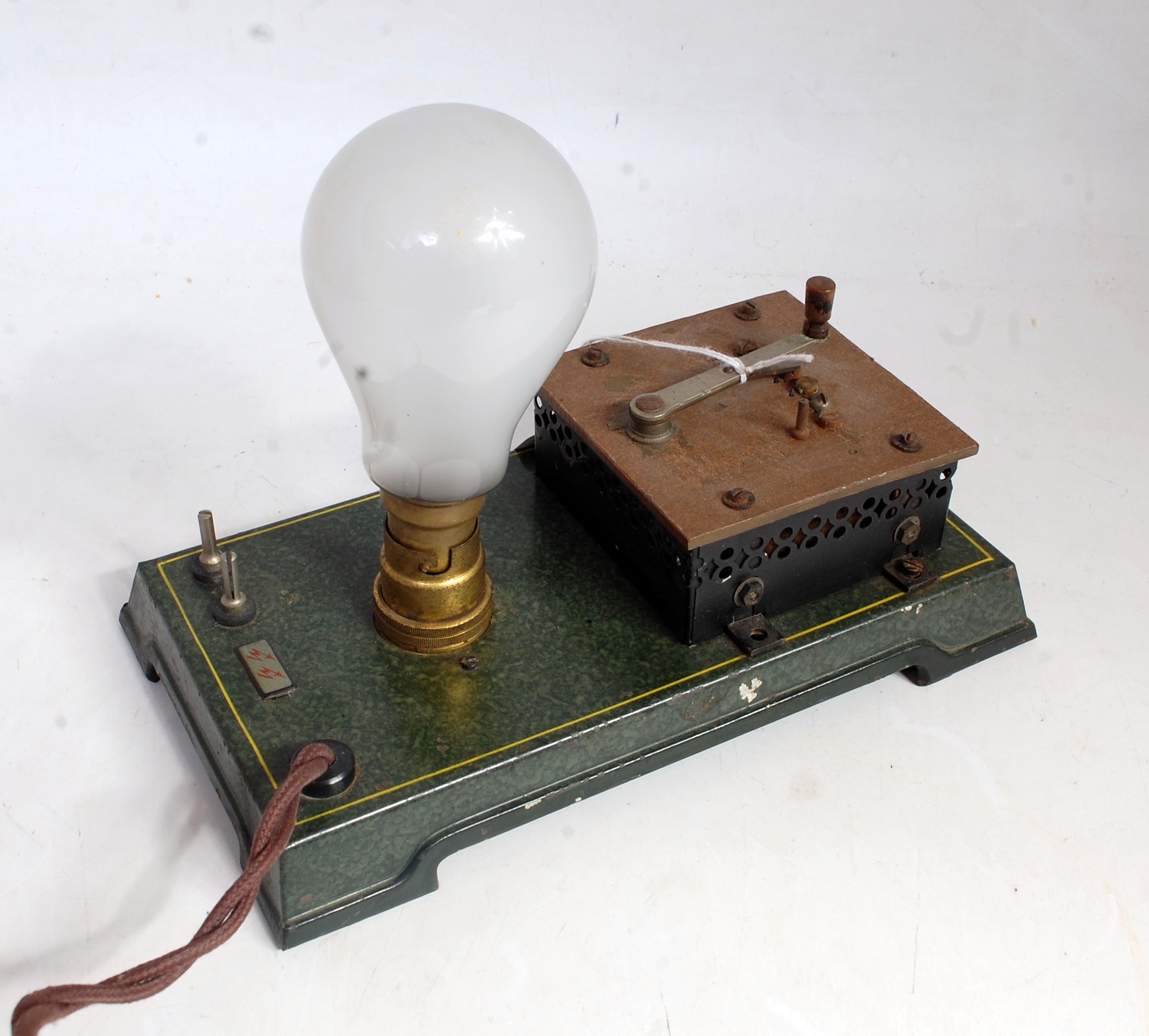 A Bing original early 20th century tinplate and electrically powered model of a light bulb control