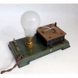 A Bing original early 20th century tinplate and electrically powered model of a light bulb control