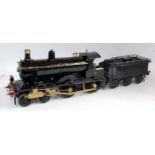 A very well engineered 2.5 inch gauge 440 spirit fired locomotive and tender, finished in black, and
